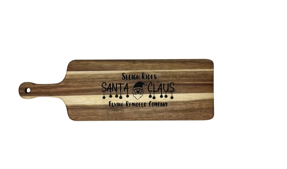 Hand-burned Sleigh Rides Santa Claus cheese board, 12 inches long by 4 inches wide