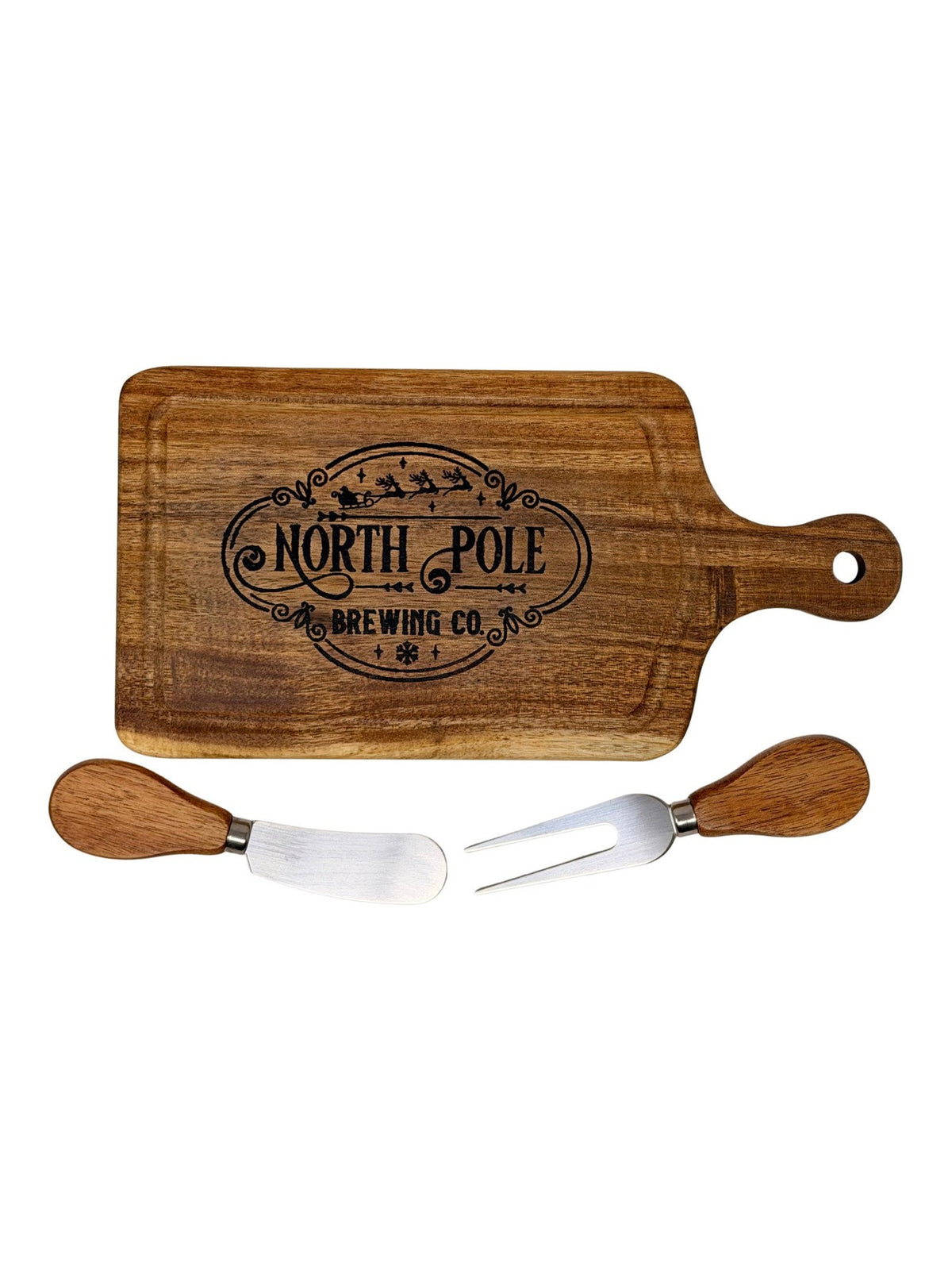 North Pole Brewing Co. cheeseboard with wood-handled cheese knife and two-tine fork