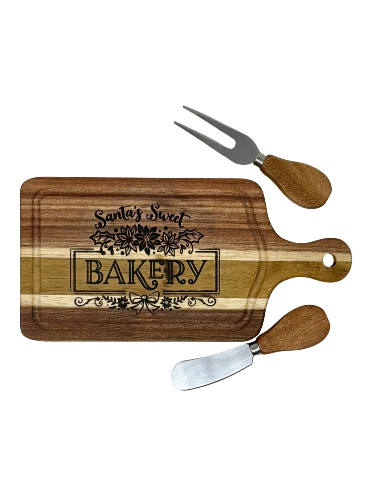 Santa's Sweet Bakery cheeseboard with wood-handled cheese knife and two-tine fork