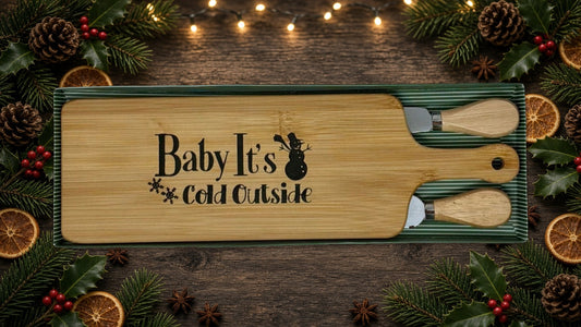 Baby It's Cold Outside cheeseboard gift set on a holiday table