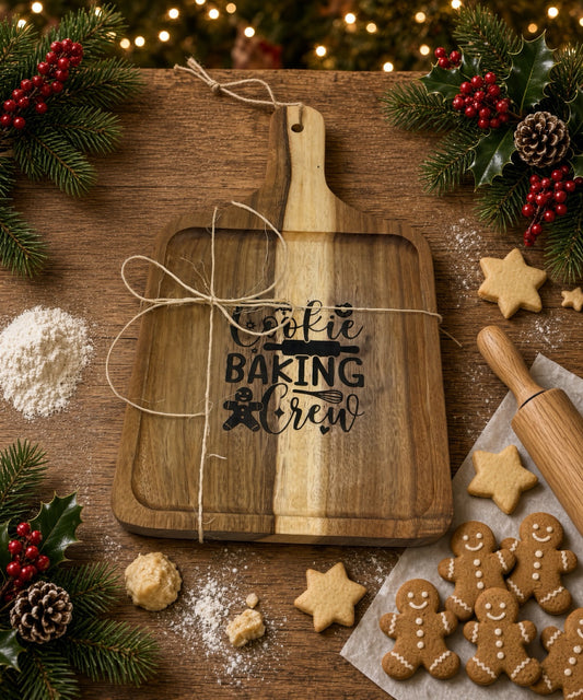 Cookie Baking Crew cutting board with gingerbread cookies, flour, and a rolling pin