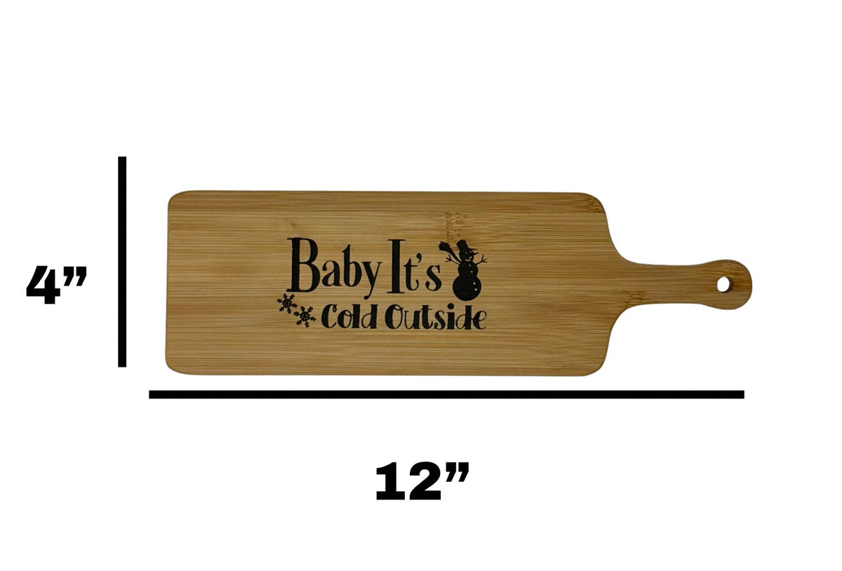 Baby It's Cold Outside cheese board measuring 12 inches long by 4 inches wide