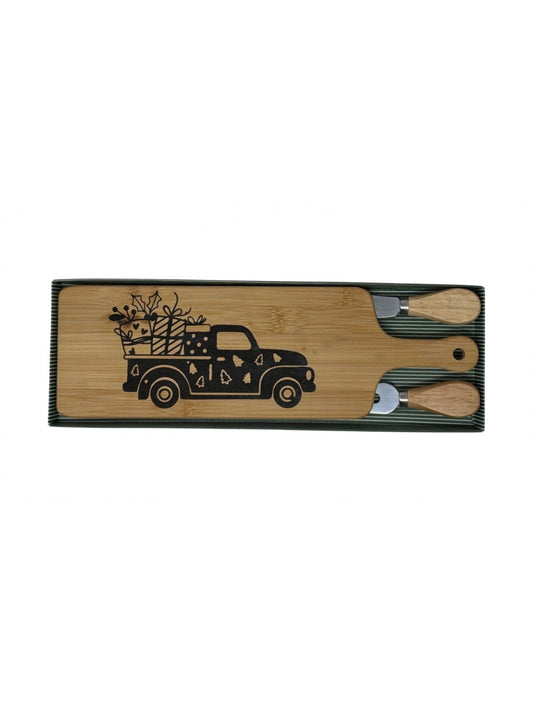 Christmas truck cheese board with wood-handled cheese fork and spreader in a green striped gift box