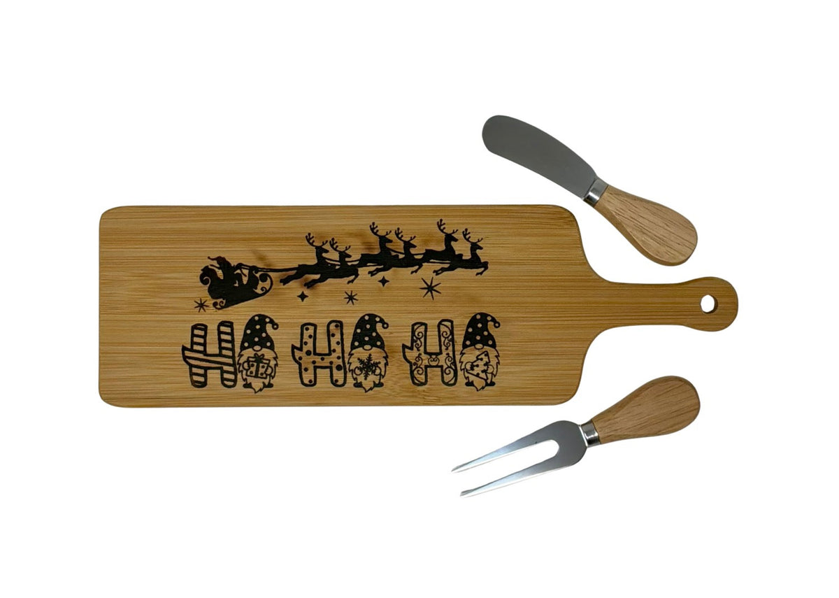 Ho Ho Ho long cheese board with wood-handled cheese fork and spreader