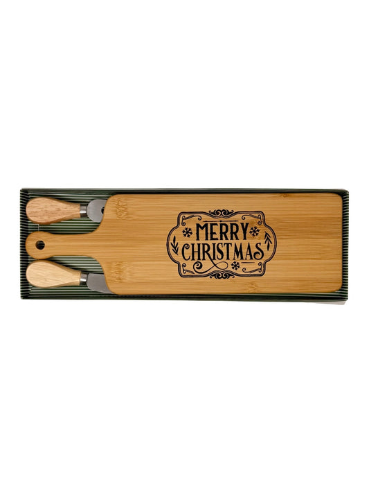 Merry Christmas cheese board with wood-handled cheese fork and spreader in a green striped gift box