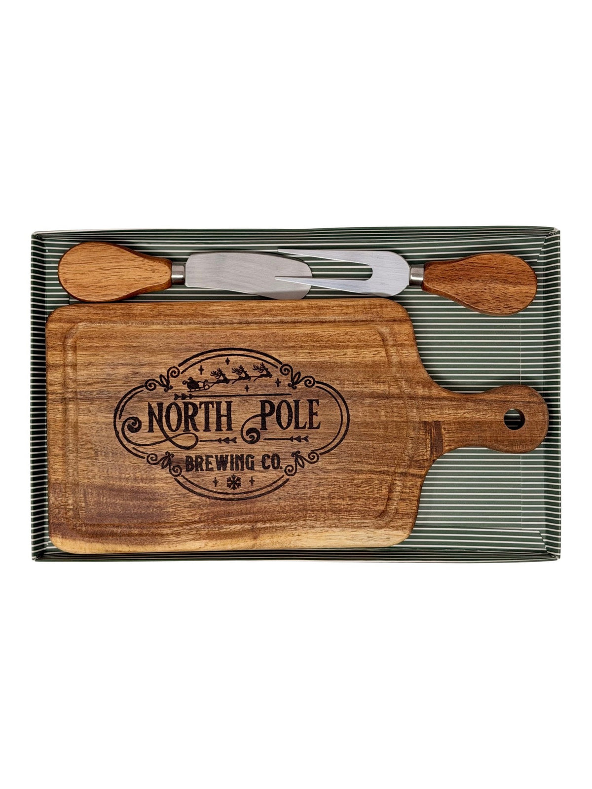 Hand-burned North Pole Brewing Co. cheeseboard with wood-handled cheese knife and fork in a green striped gift box