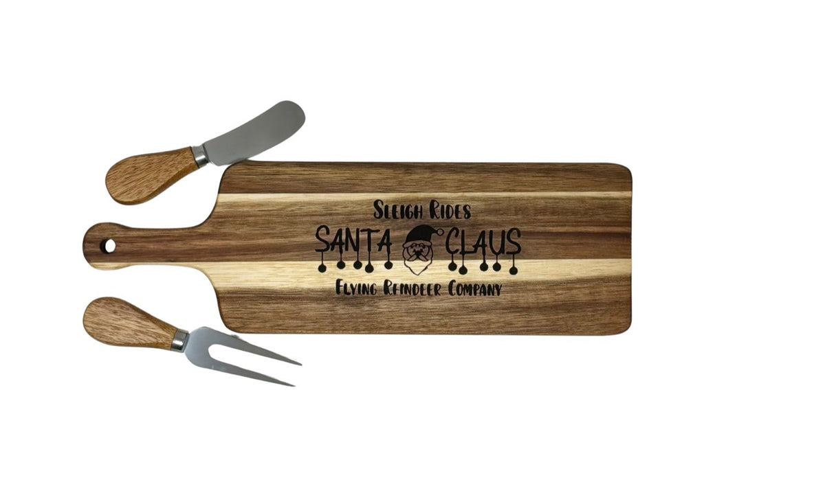 Sleigh Rides Santa Claus cheese board with wood-handled cheese fork and spreader
