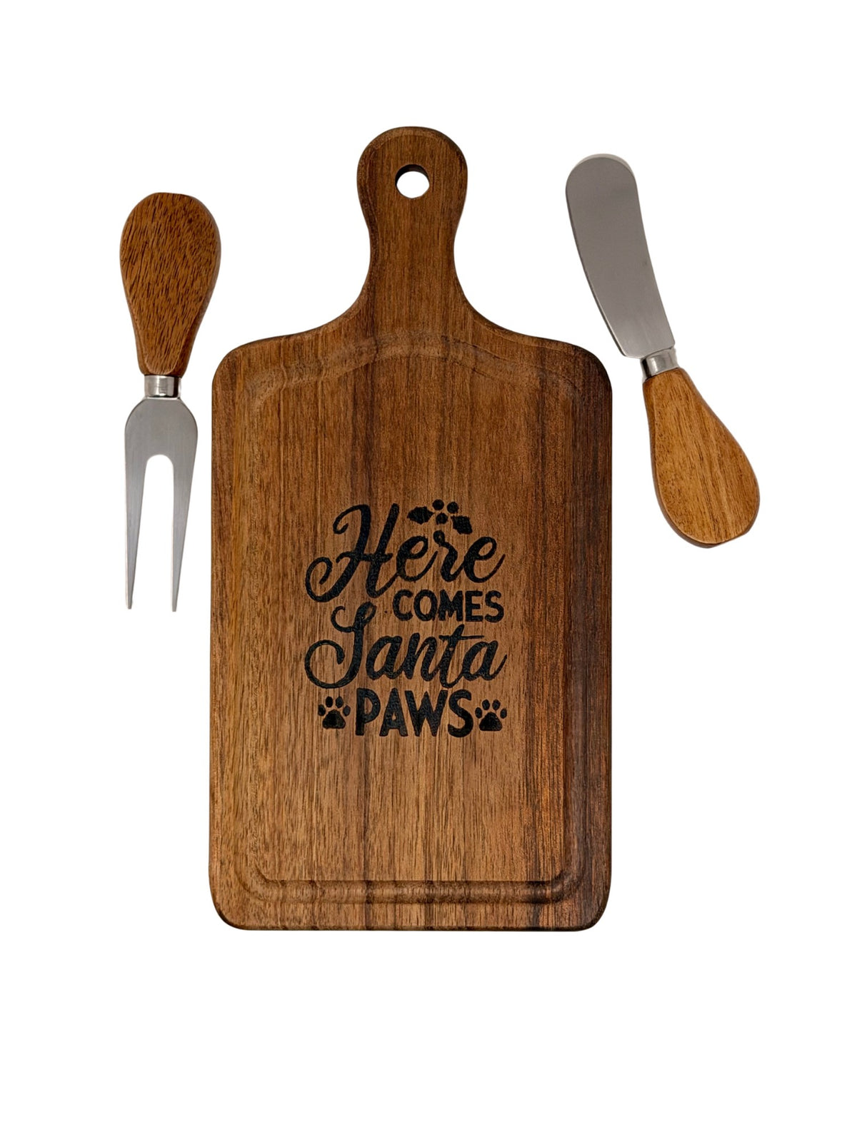 Here Comes Santa Paws cheese board with wood-handled cheese knife and two-tine fork